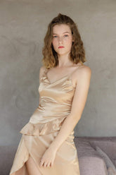 Silk asymmetric ruffle hem dress with wrap front and draped neckline for modern elegance